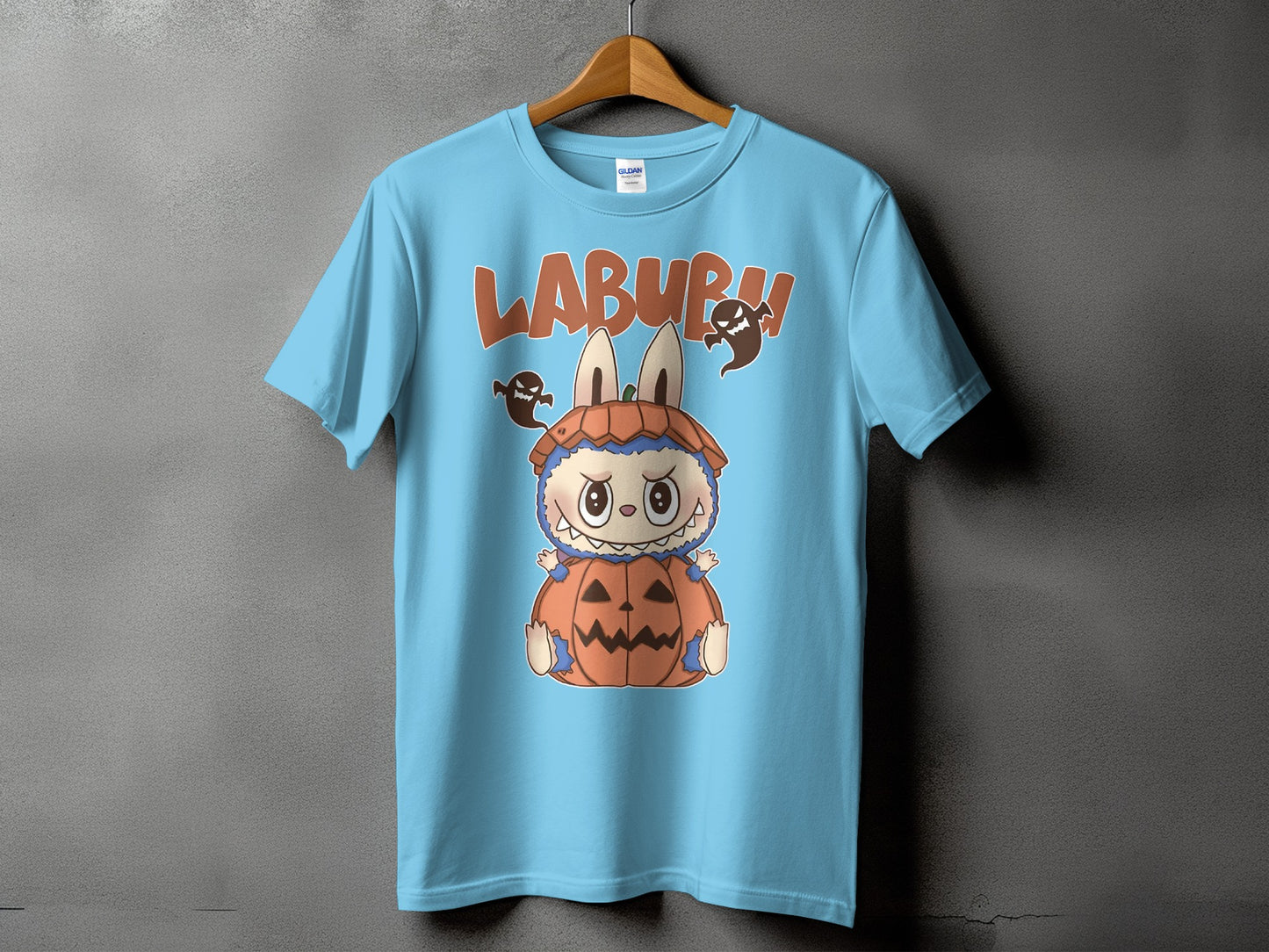 Light blue t-shirt with cartoon character in pumpkin costume and "LABURH" text.