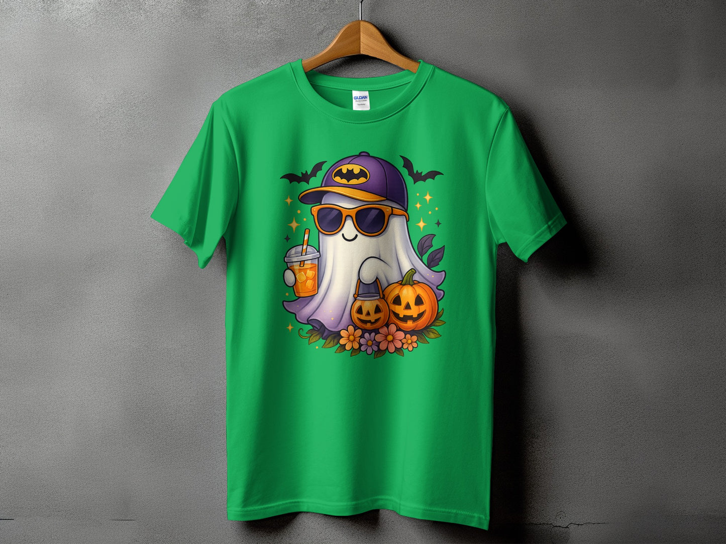 Green t-shirt with cartoon ghost, pumpkins, and Halloween bats graphic.