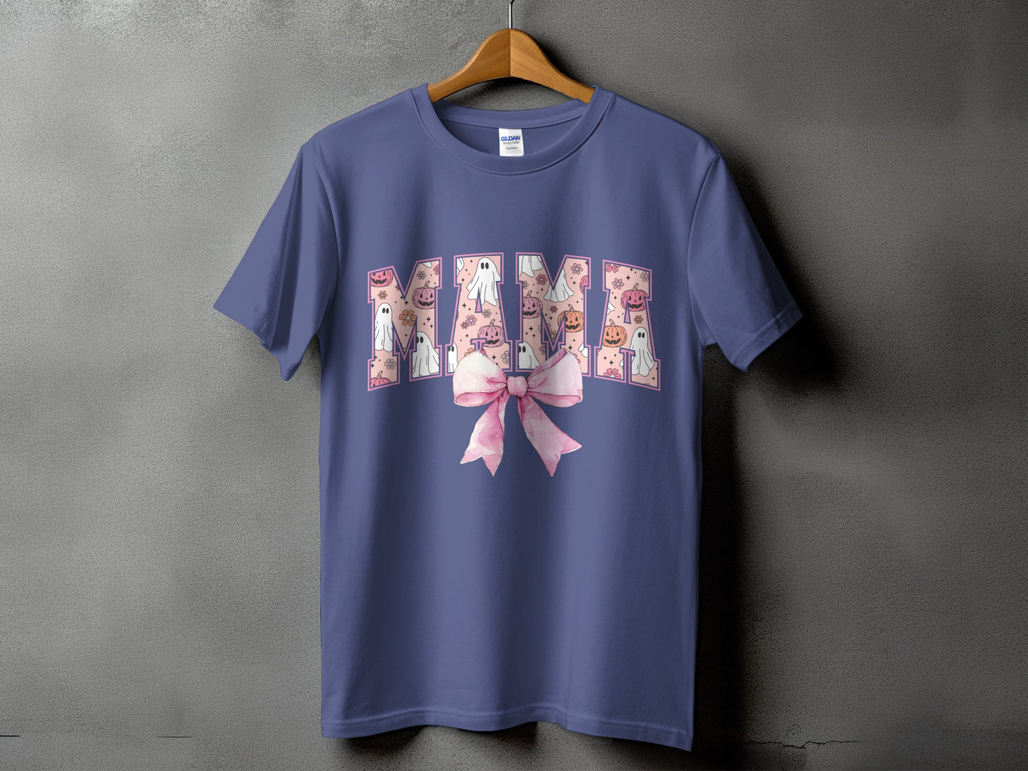 Purple t-shirt with "Mama" text filled with Halloween ghosts, pumpkins, and flowers.