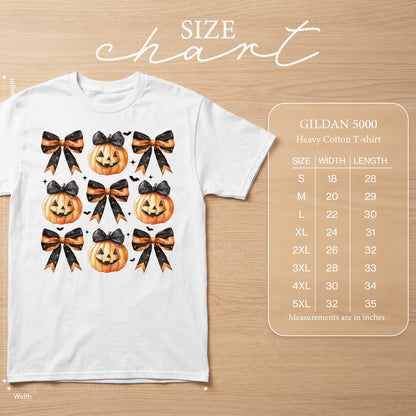 White t-shirt with repeating Halloween pumpkin and bow pattern, size chart included.