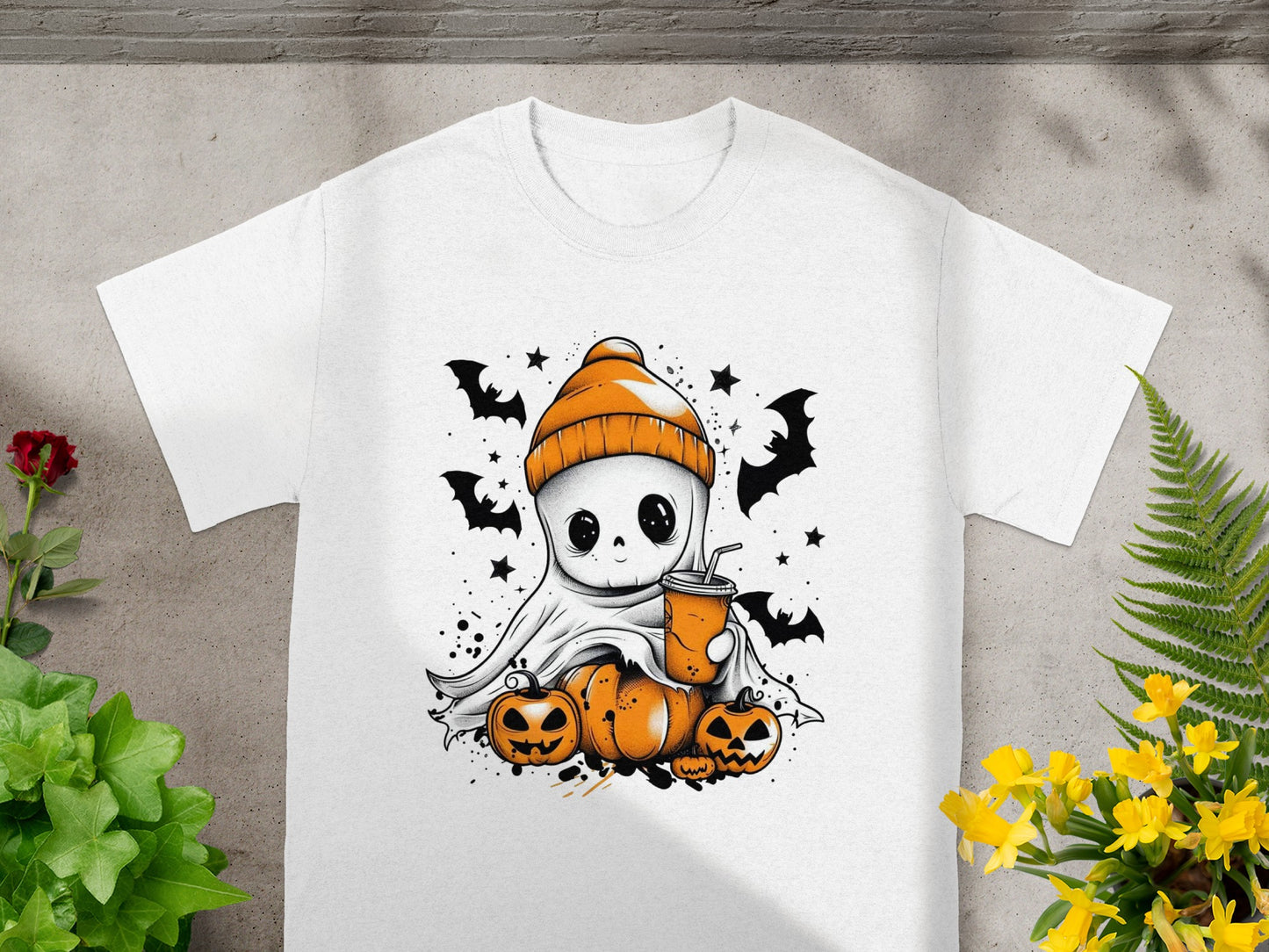 Cute ghost in orange beanie with pumpkins and bats graphic on white t-shirt.