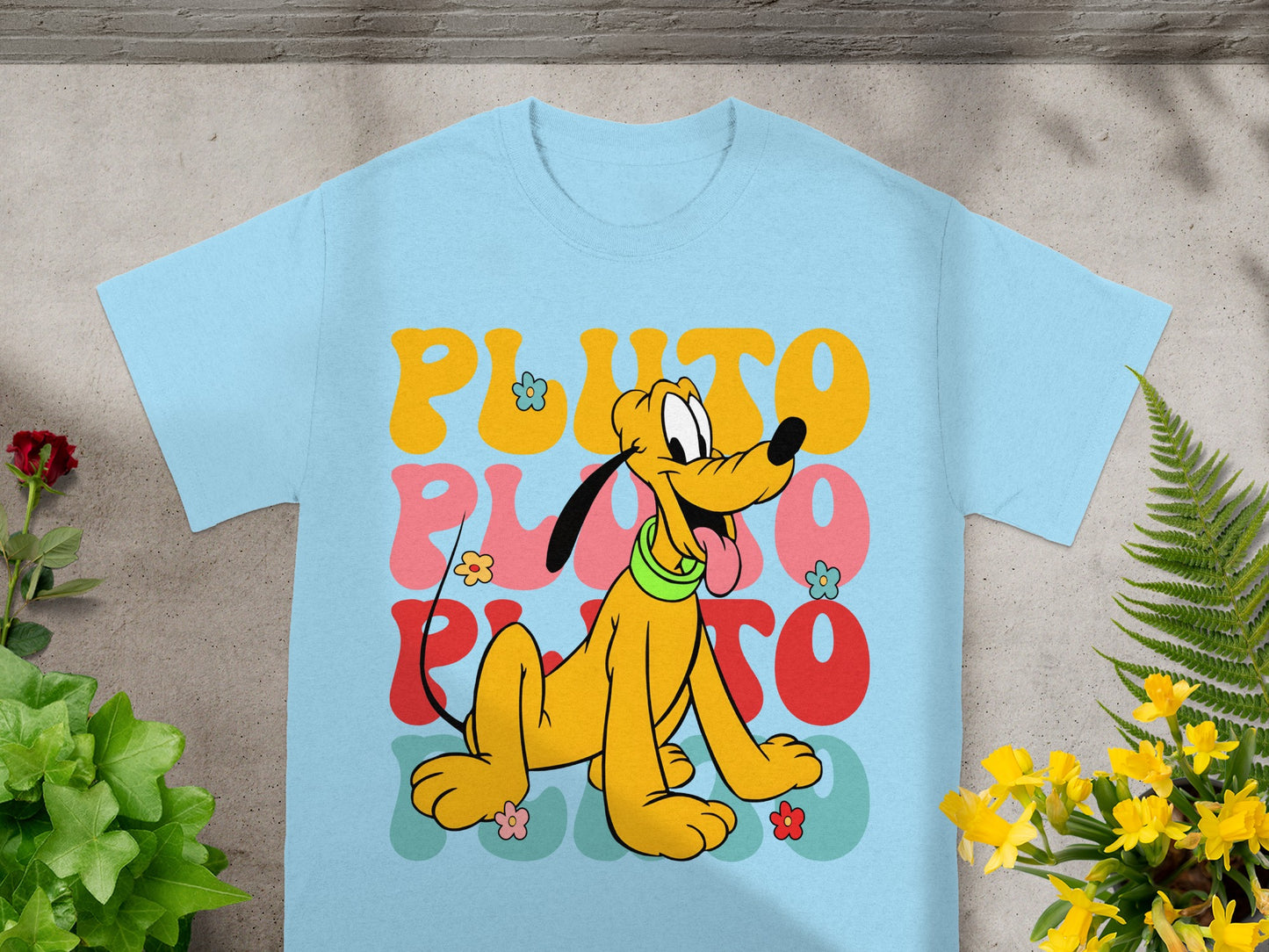 Light blue t-shirt with cartoon Pluto and colorful "PLUTO" text.