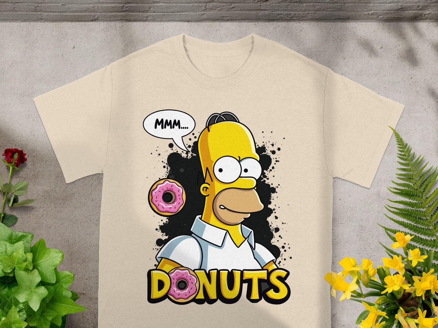 Homer Simpson with donuts, saying "MMM...", on a tan t-shirt.