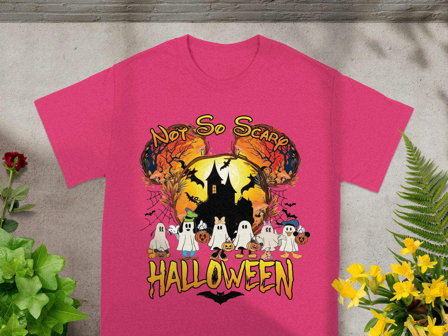 Pink t-shirt with cartoon ghosts and text "Not So Scary Halloween"