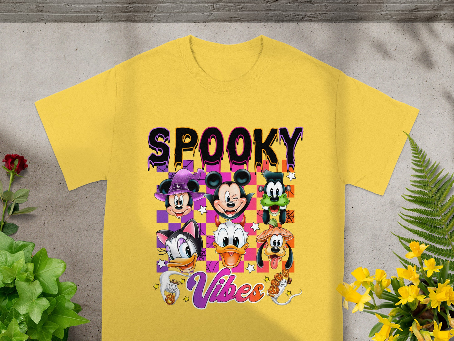 Yellow t-shirt with "SPOOKY Vibes" and Disney characters in Halloween costumes.