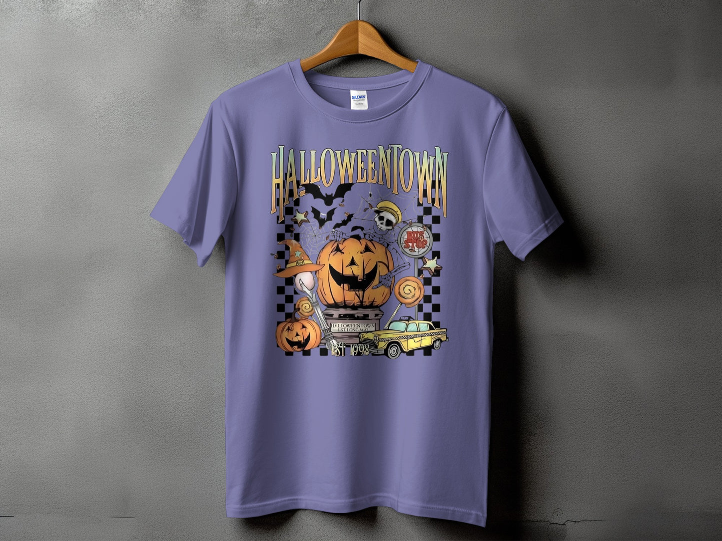 Purple t-shirt with "Halloweentown Est 1998" graphic featuring pumpkins, bats, and a yellow taxi.