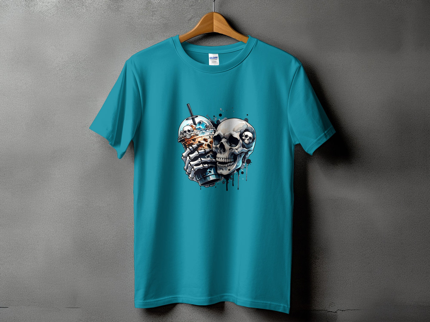 Teal t-shirt with a graphic of a skull holding a coffee drink.