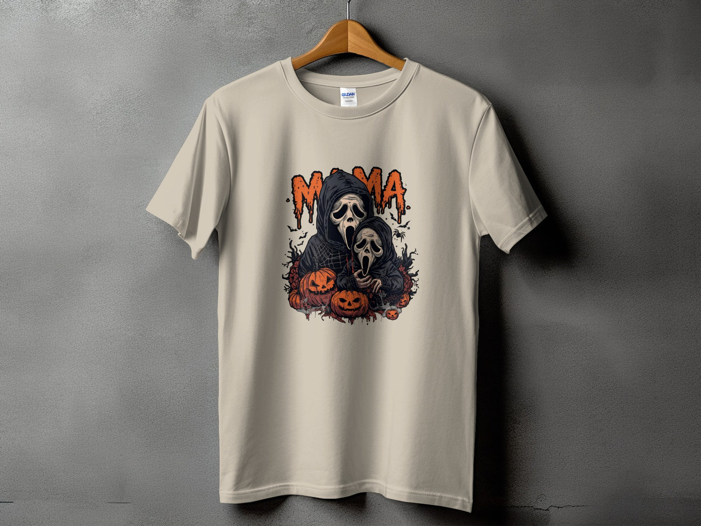Cream t-shirt with "MAMA" and two ghost figures surrounded by pumpkins.