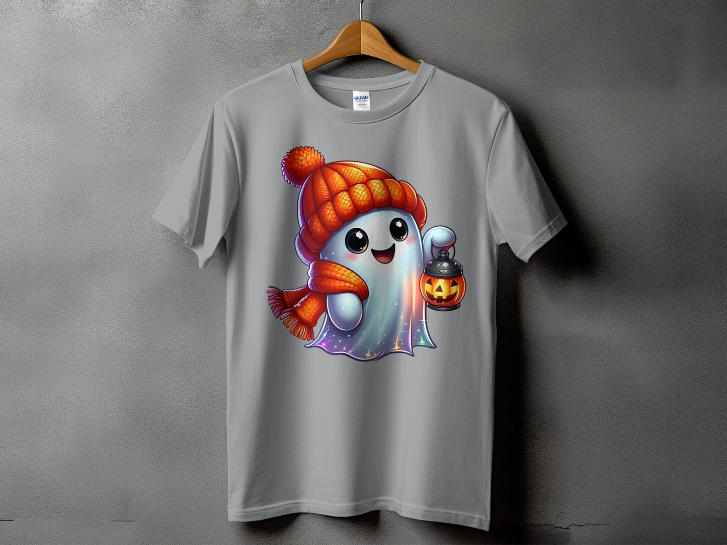 Ghost with pumpkin lantern, wearing hat and scarf, on gray t-shirt.