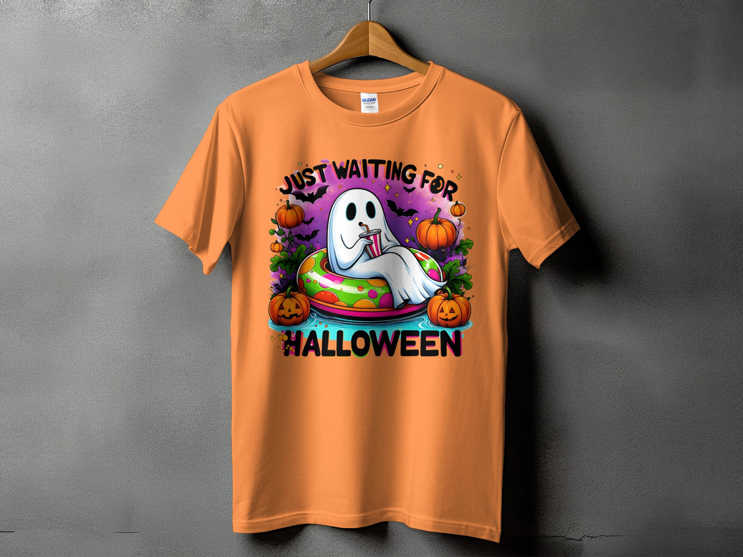 Orange t-shirt with ghost graphic saying "Just waiting for Halloween".