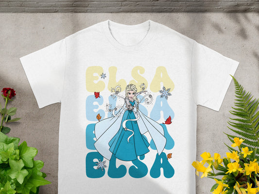White t-shirt with Elsa and large blue "ELSA" text and snowflakes.