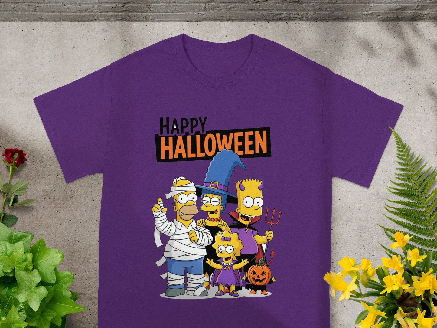 The Simpsons \"Happy Halloween\" graphic on a purple t-shirt with costumes.