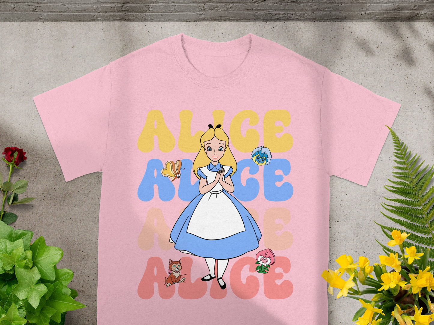 Pink t-shirt with "ALICE" in colorful letters and Alice in Wonderland characters.