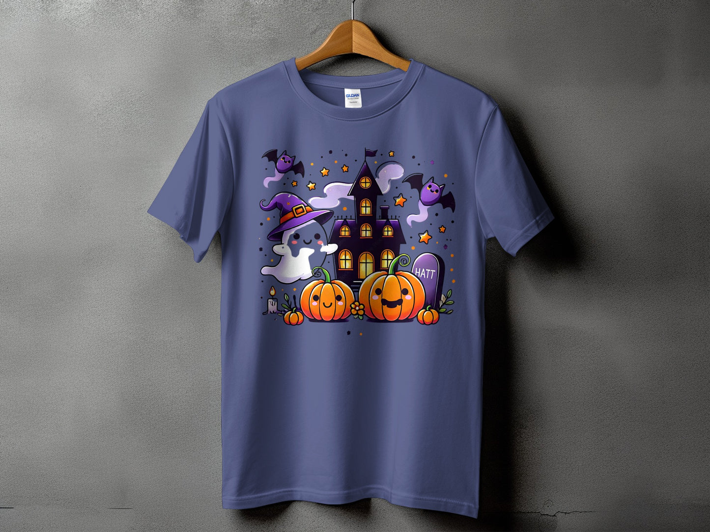 Purple t-shirt with a cute Halloween graphic featuring a ghost, pumpkins, bats, and haunted house.