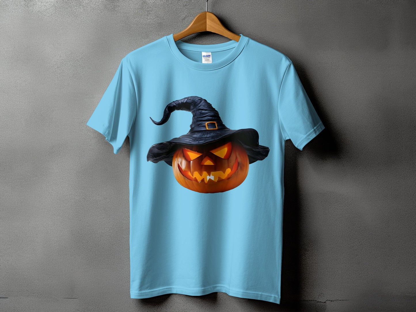 Light blue t-shirt featuring a jack-o'-lantern with a witch hat.