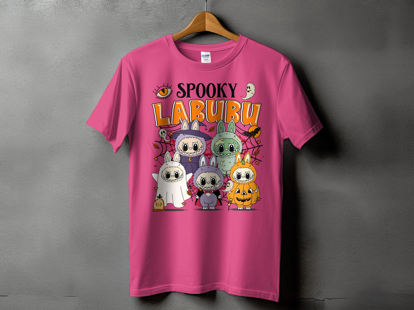 Pink t-shirt with "Spooky Labubu" Halloween graphic featuring cute costumed characters.