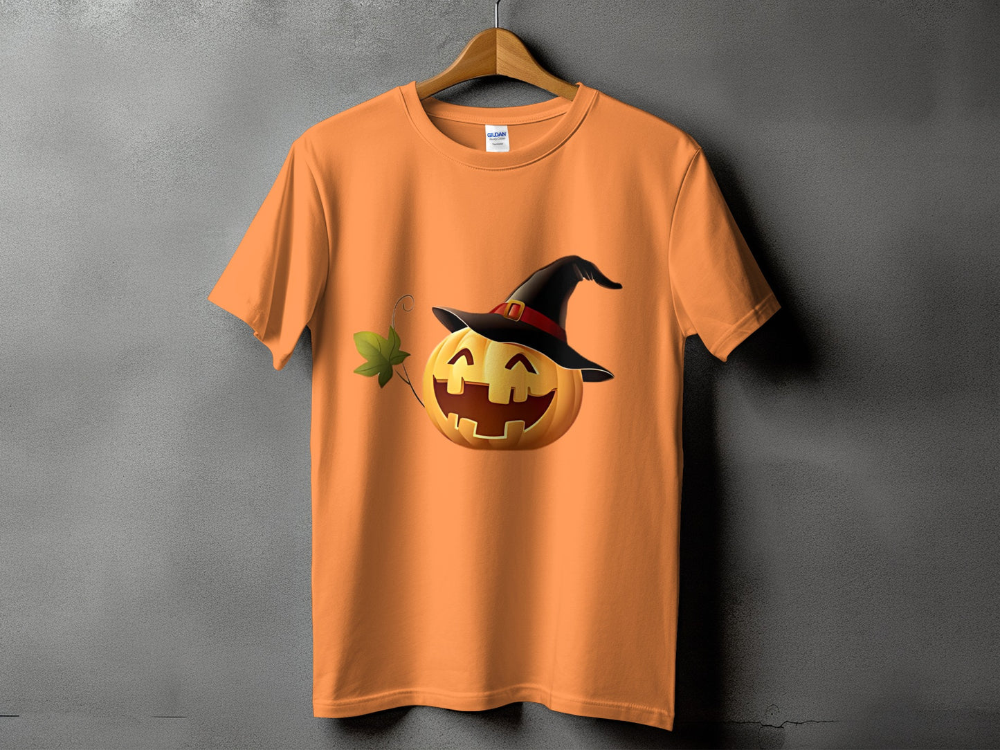 Orange t-shirt with smiling jack-o'-lantern wearing a witch hat.