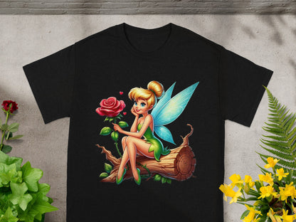 Tinkerbell fairy with a rose sits on a log, printed on a black t-shirt.