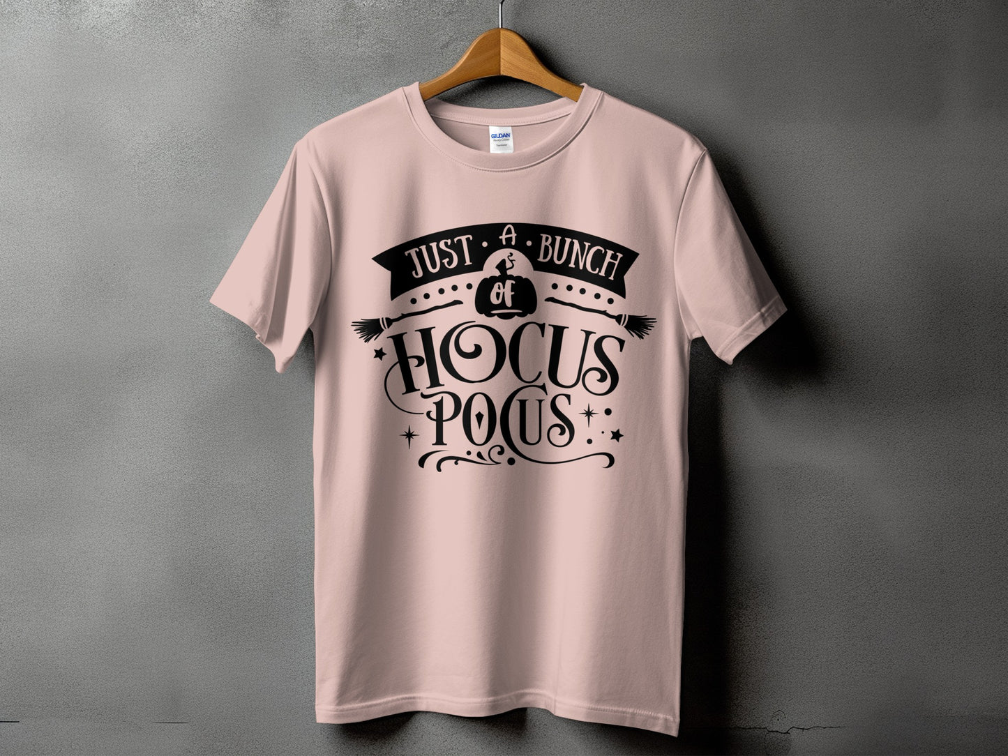 Pink t-shirt with black text reading "Just a bunch of Hocus Pocus" and Halloween graphics.