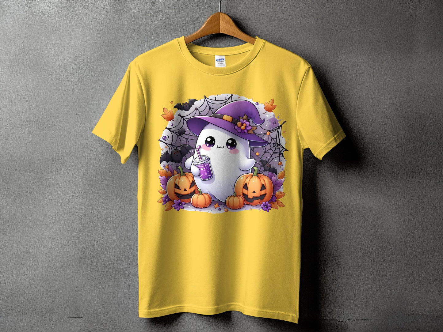 Yellow t-shirt with a cute Halloween ghost, pumpkins, bats, and spiderwebs.