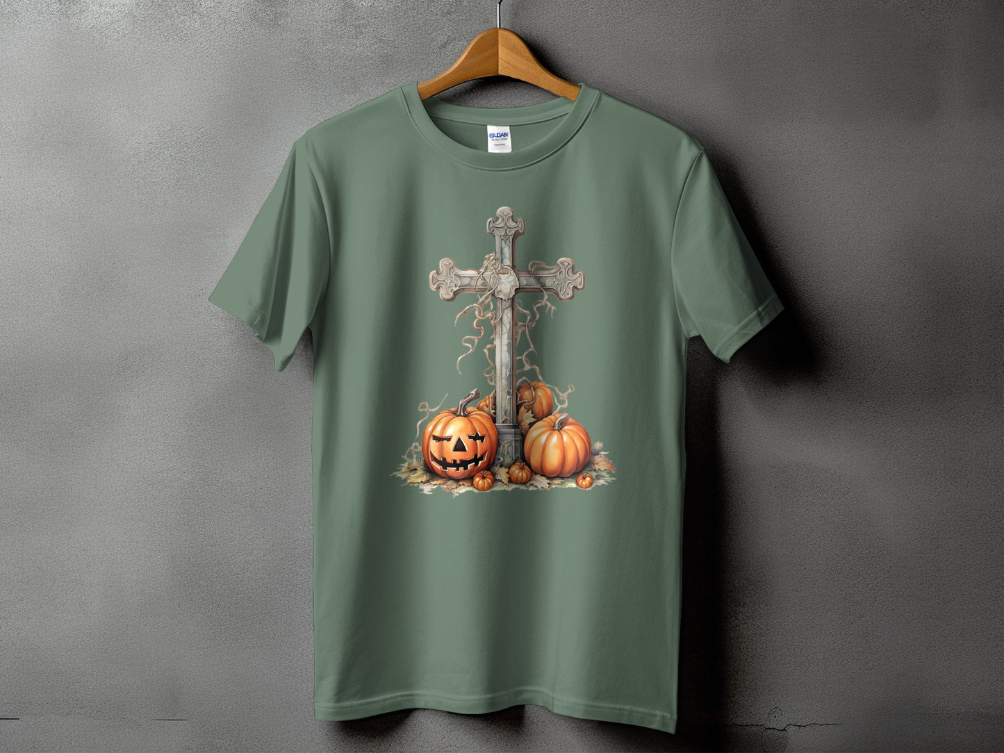 Green t-shirt with a graphic of a cross and pumpkins.