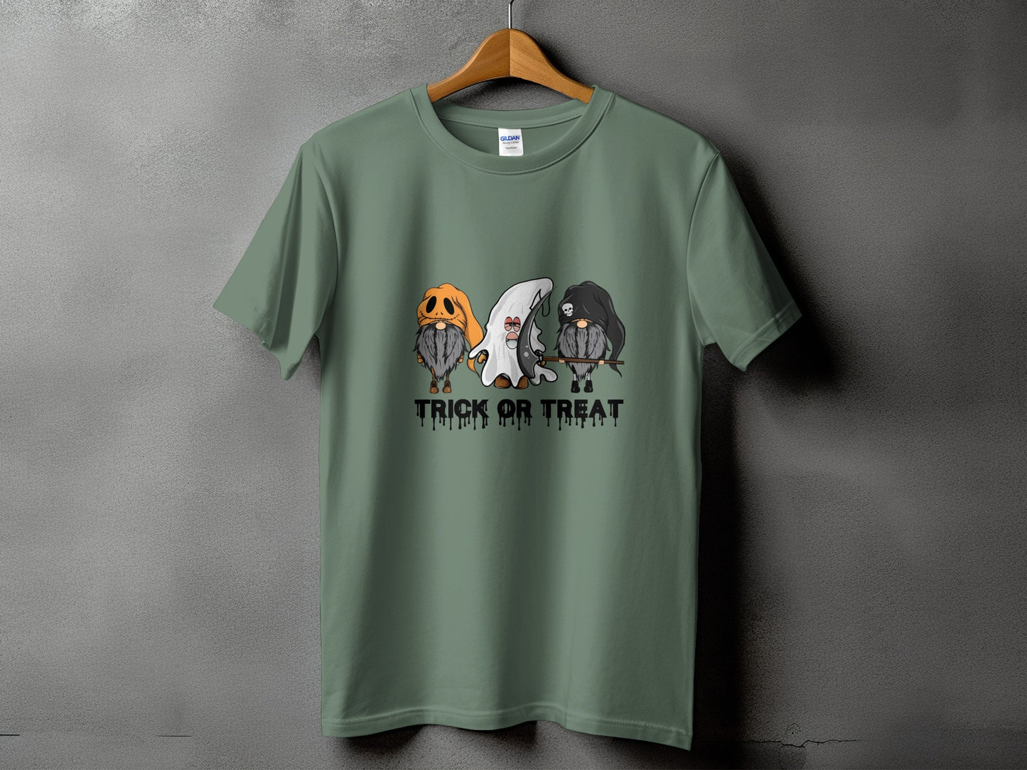 Green t-shirt with three gnomes in Halloween costumes and "Trick or Treat" text.