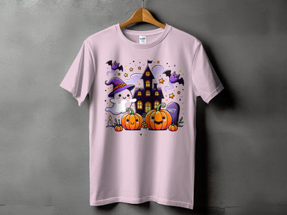 Pink t-shirt with a kawaii Halloween scene featuring pumpkins, ghost, bats, and haunted house.