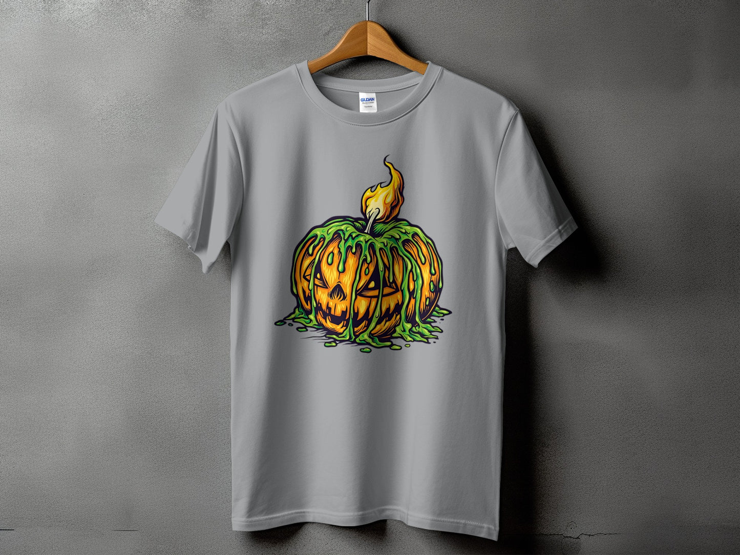 Gray t-shirt with a spooky pumpkin design dripping green slime and on fire.