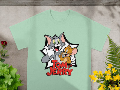 Tom and Jerry characters smiling on a light green t-shirt.