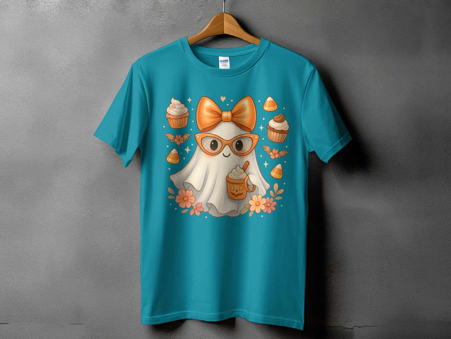Teal t-shirt with a cute ghost wearing glasses and holding a pumpkin latte.