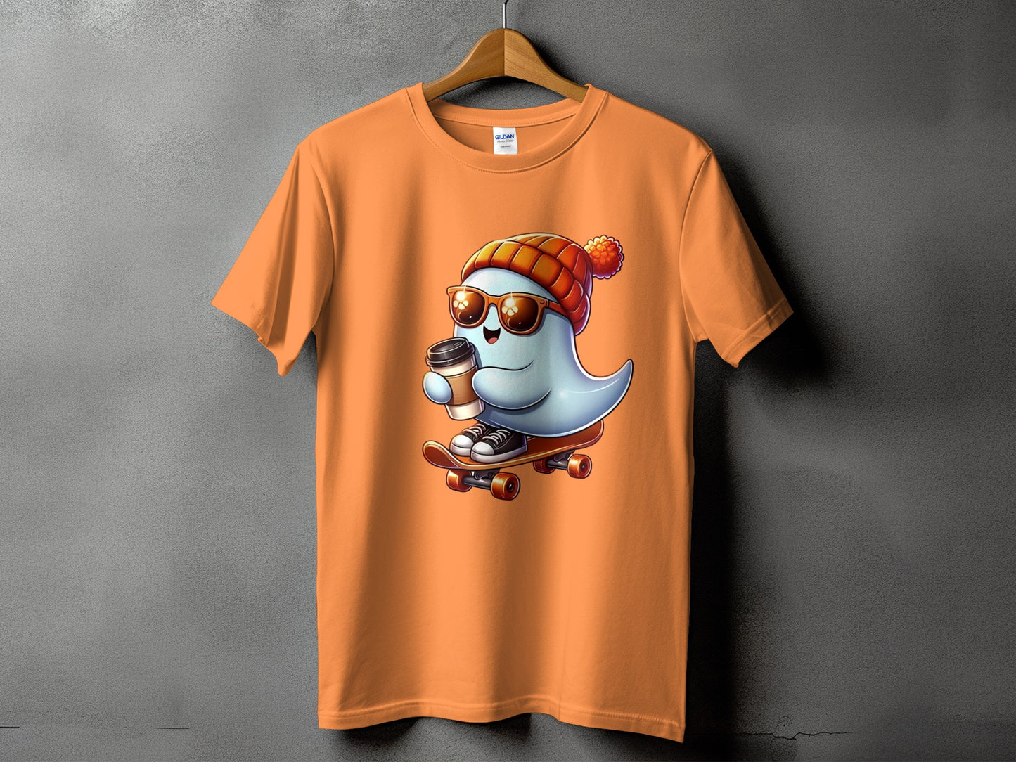 Orange t-shirt with cartoon ghost wearing beanie, sunglasses, and holding coffee on a skateboard.