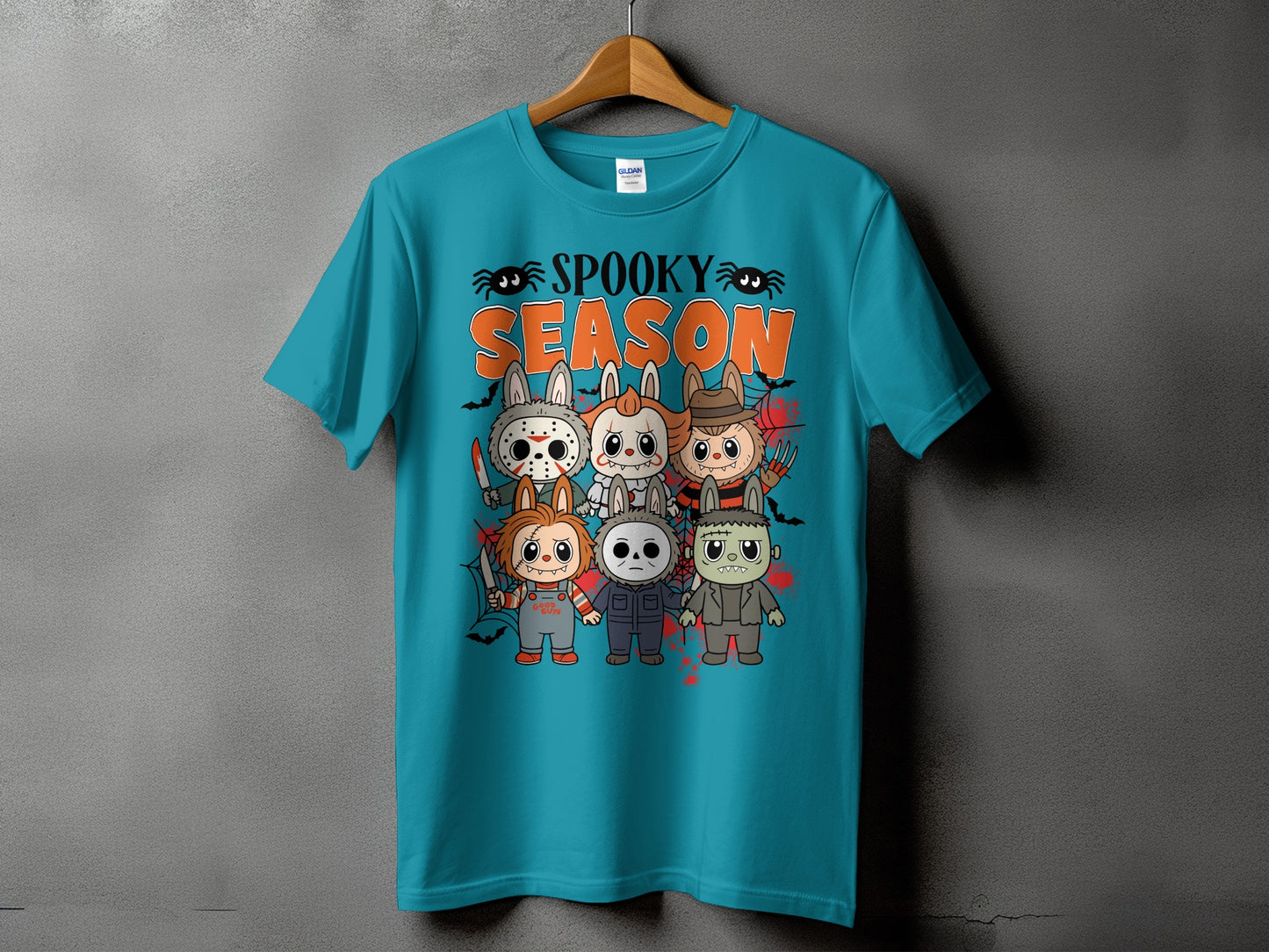 Teal t-shirt with "Spooky Season" text and cartoon horror characters.
