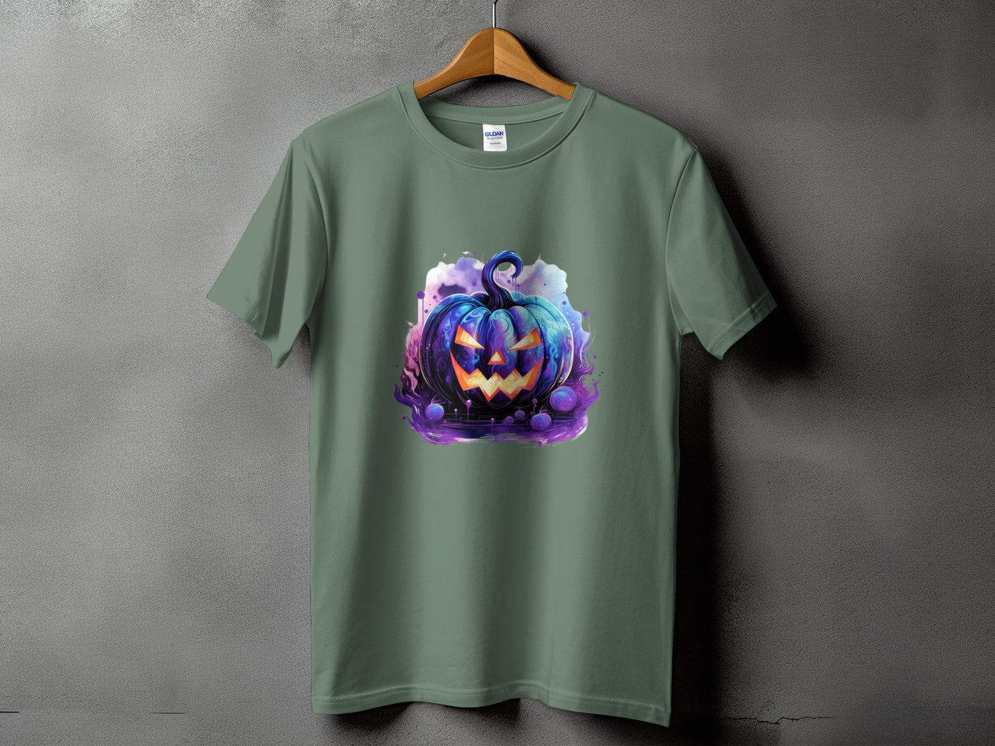 Green t-shirt with a colorful, spooky jack-o'-lantern graphic on a dark background.