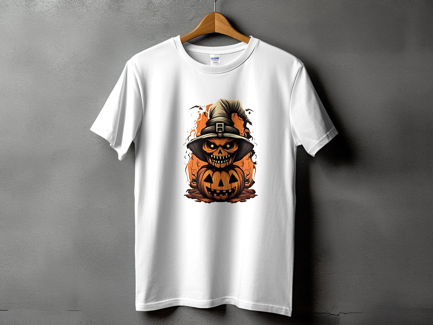 White t-shirt with a scary pumpkin wearing a witch hat graphic.
