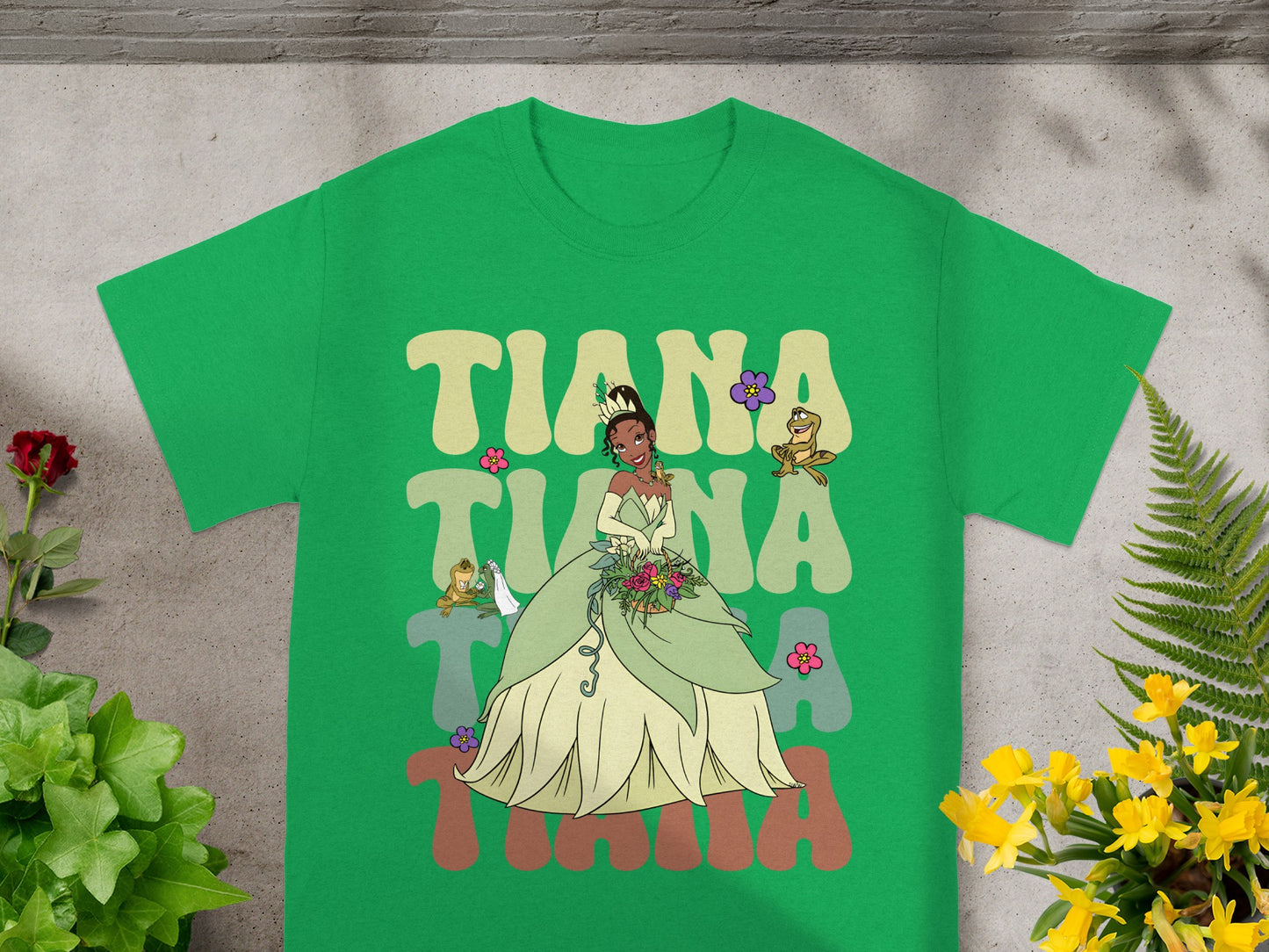 Green t-shirt with Tiana from Princess and the Frog graphic.