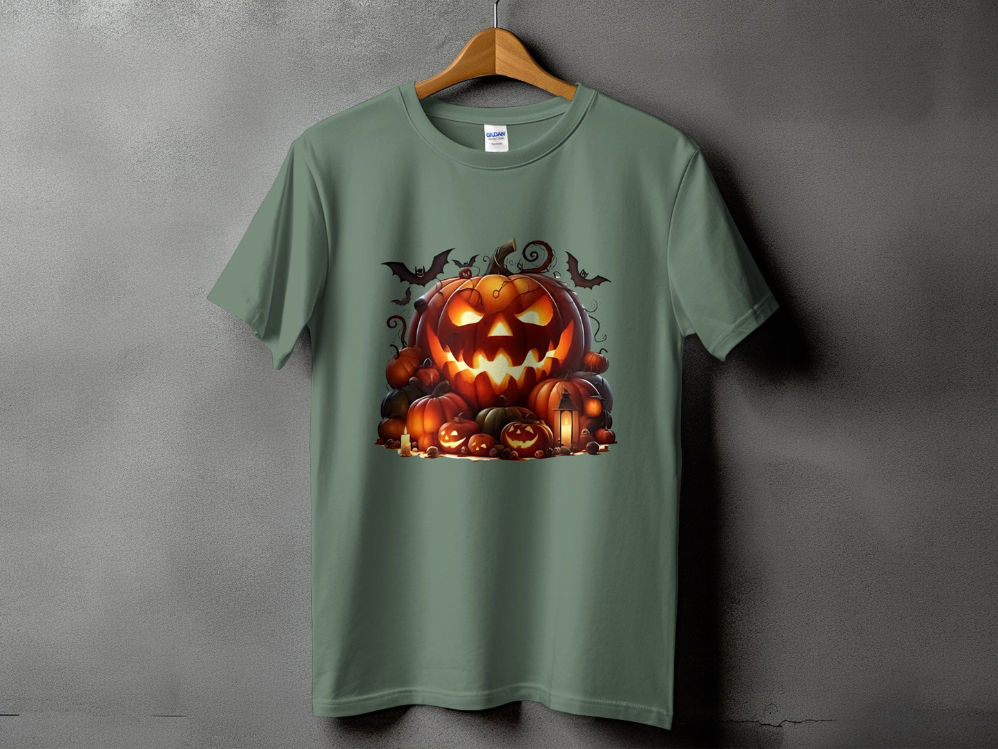 Green t-shirt with a Halloween graphic featuring a carved pumpkin and other pumpkins.