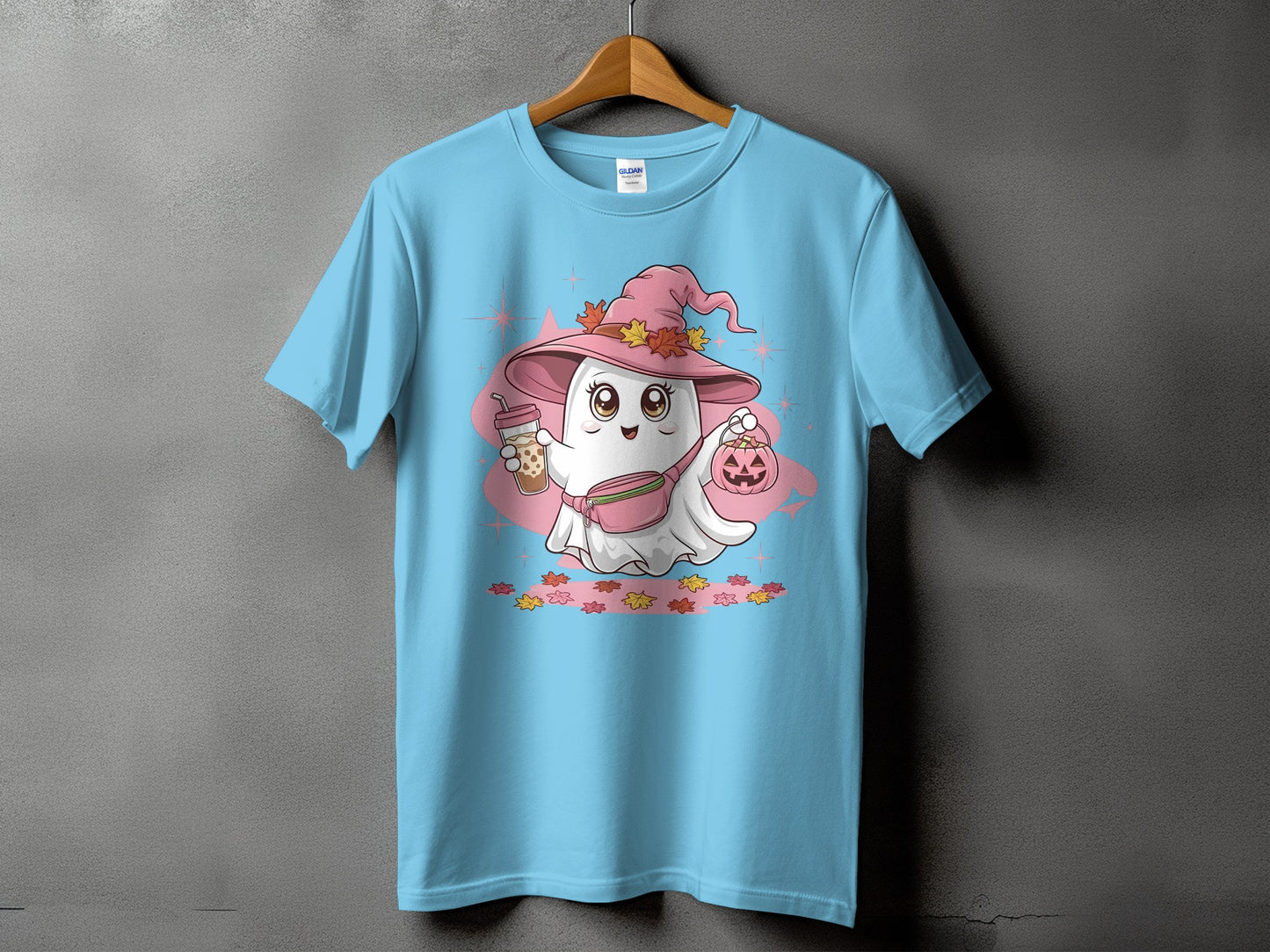 Light blue t-shirt with a cute ghost wearing a witch hat, holding boba and a pumpkin.