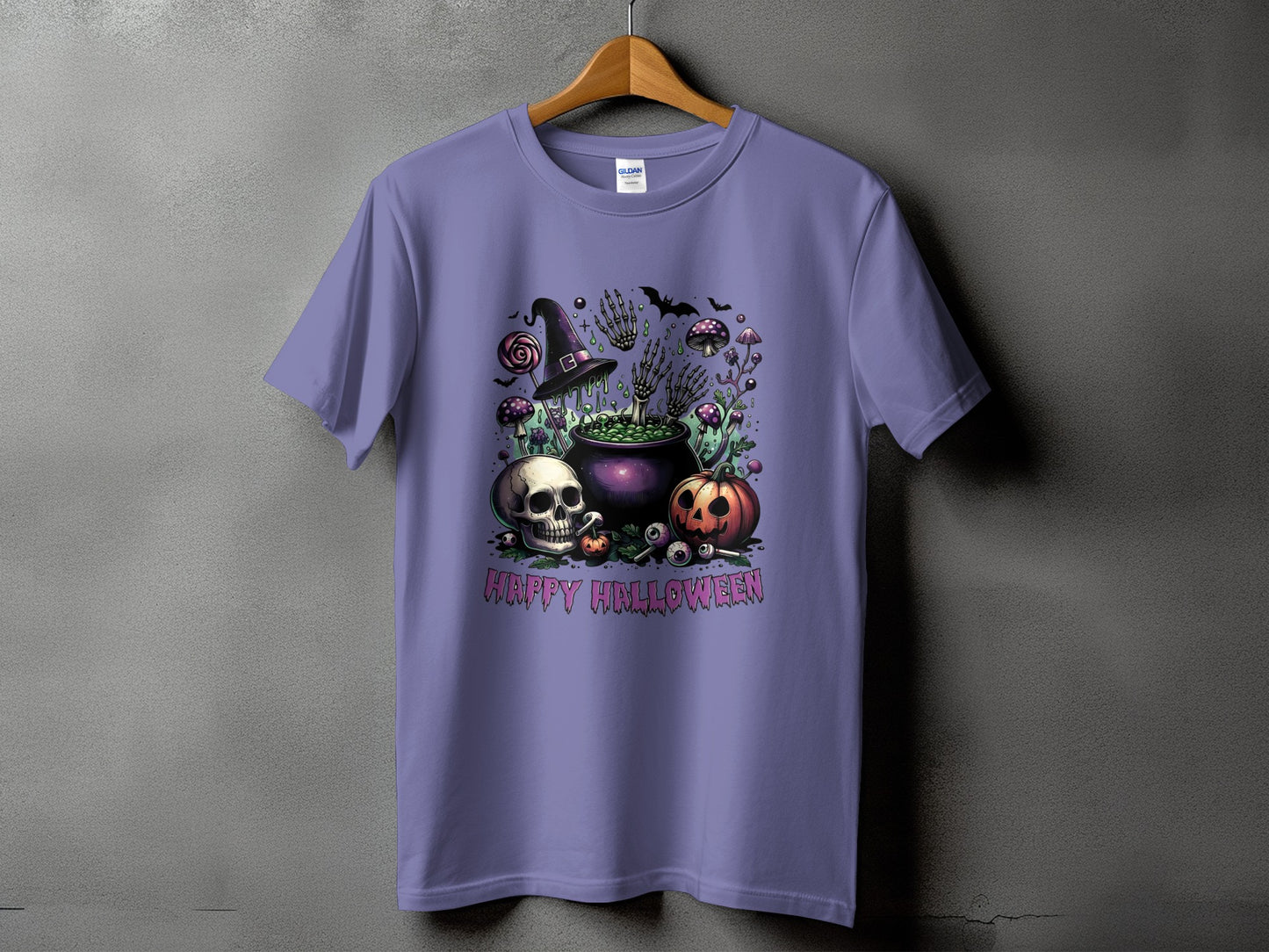 Purple t-shirt with Halloween graphic featuring a cauldron, skull, pumpkin, and witch hat.