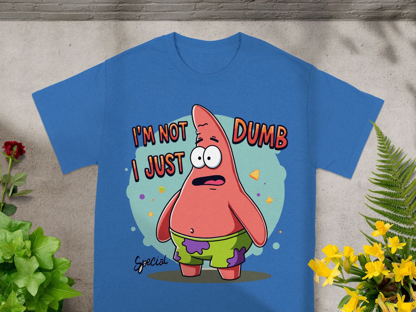 Blue t-shirt with Patrick Star saying "I'm not dumb I just special".