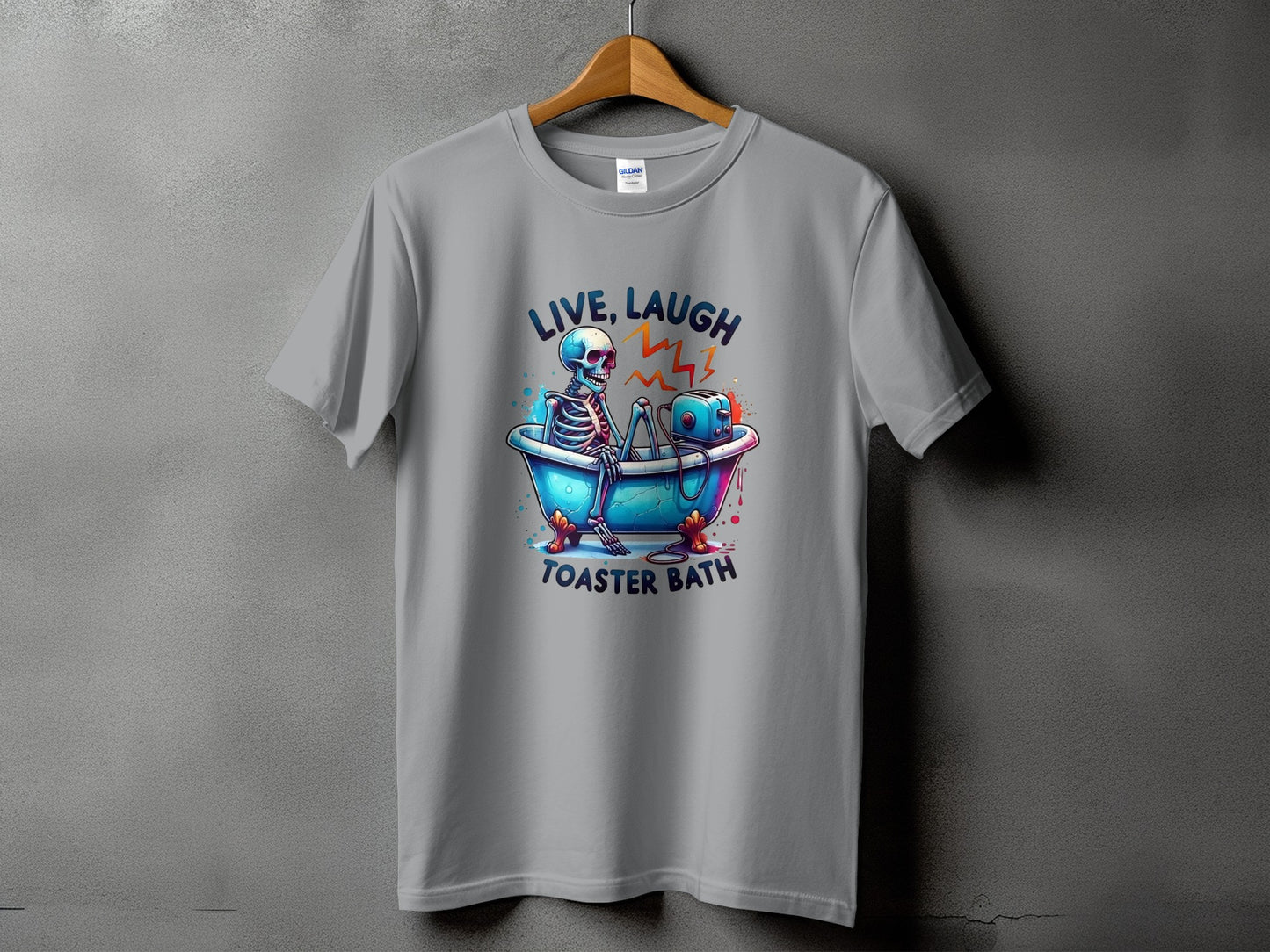 Gray t-shirt with graphic of skeleton in bathtub with toaster, text "LIVE, LAUGH TOASTER BATH".