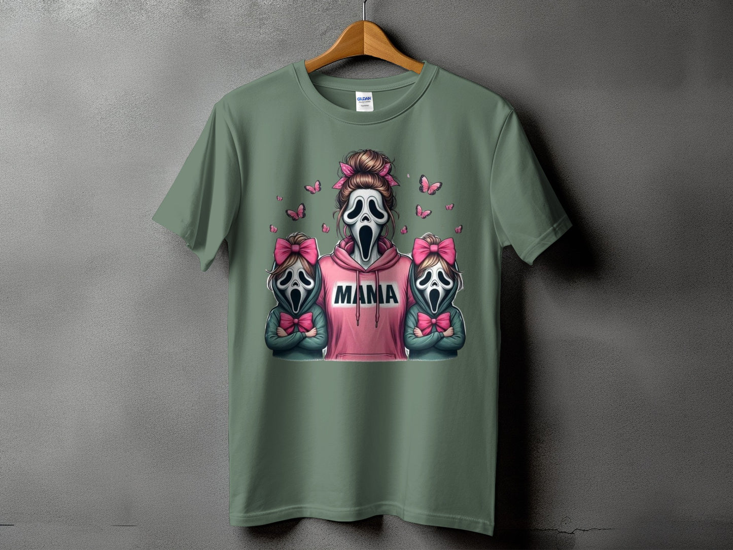 Ghostface mama and twins graphic on a sage green t-shirt with pink butterflies.