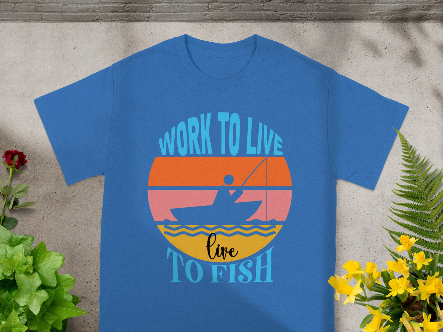 Blue t-shirt with "Work to live, live to fish" graphic.