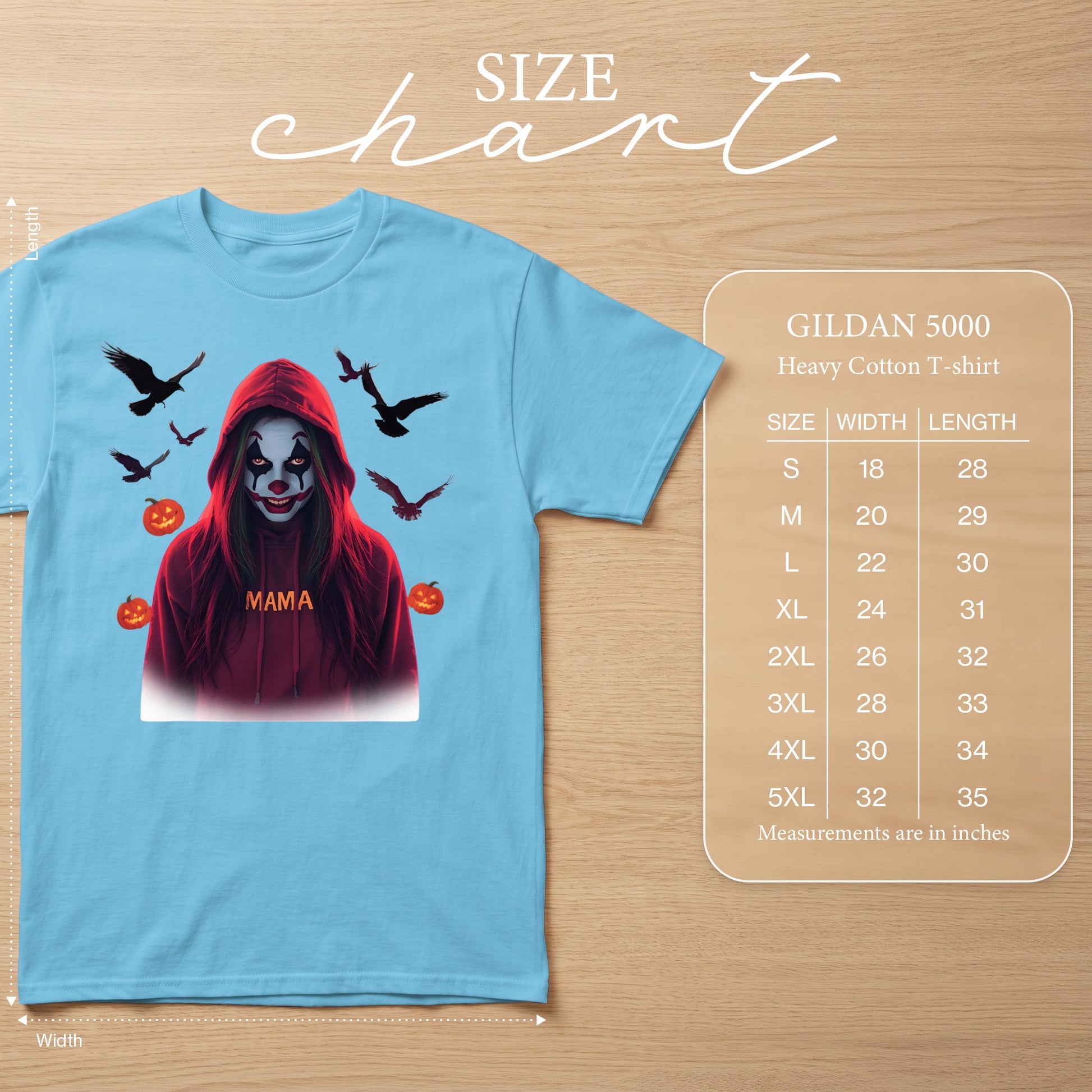 Light blue t-shirt with creepy clown graphic, crows, pumpkins, and size chart.