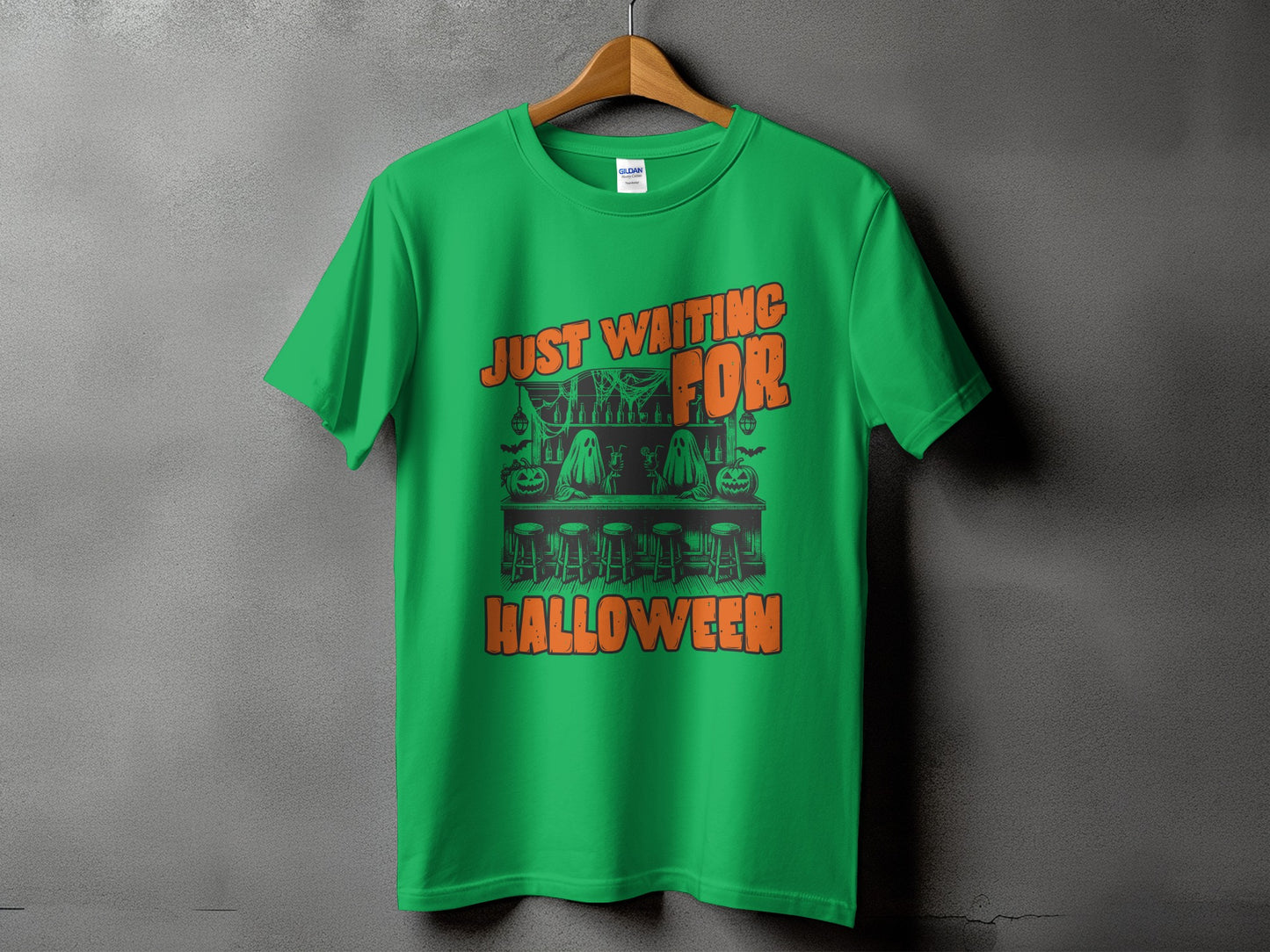 Green t-shirt with "Just Waiting For Halloween" text and Halloween bar graphic.
