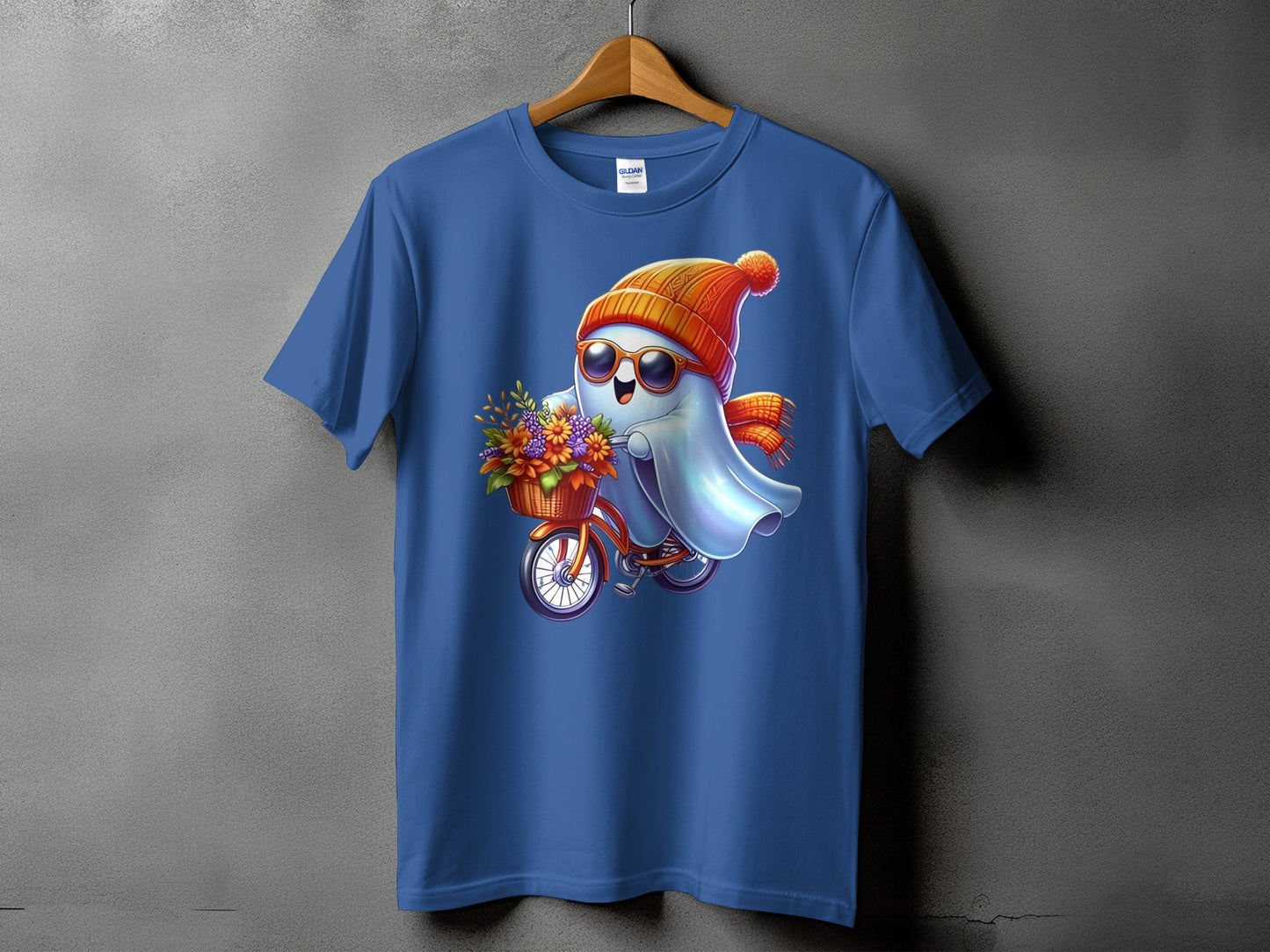 Blue t-shirt with a cute ghost riding a bicycle with flowers.