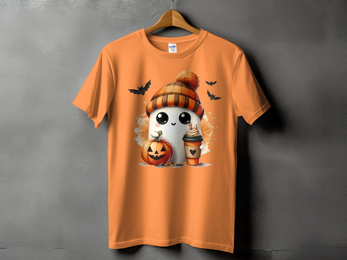 Orange t-shirt with a cute ghost, pumpkin, coffee, and bats Halloween graphic.