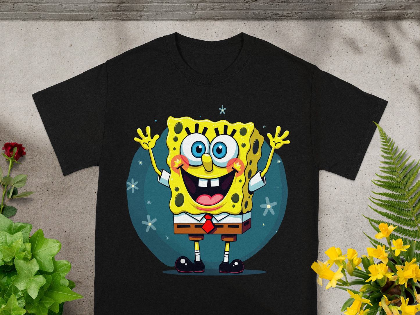 Black t-shirt featuring a cartoon Spongebob Squarepants character with arms raised.
