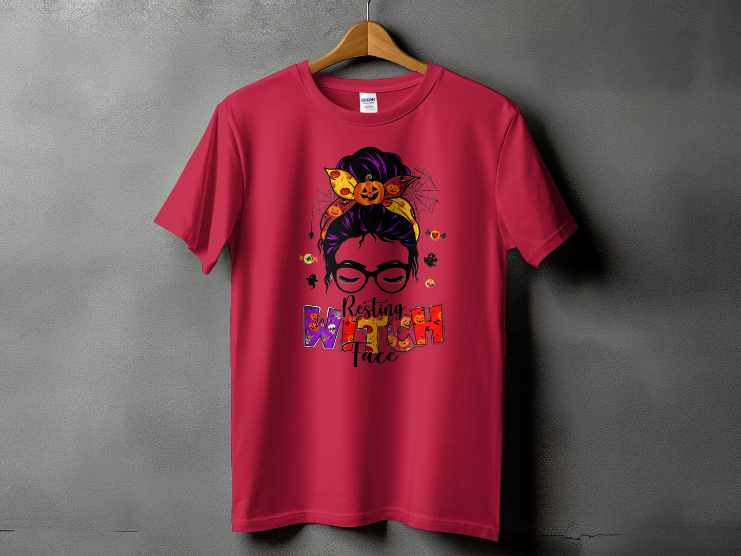 Red t-shirt with Halloween graphic of woman with messy bun, pumpkins, and "Resting Witch Face".