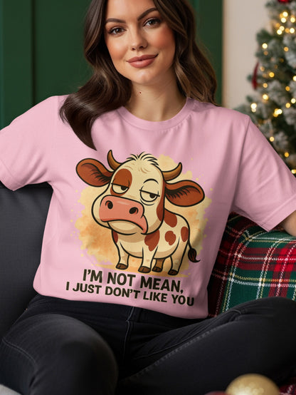 Pink t-shirt with cartoon cow and text "I'M NOT MEAN, I JUST DON'T LIKE YOU".