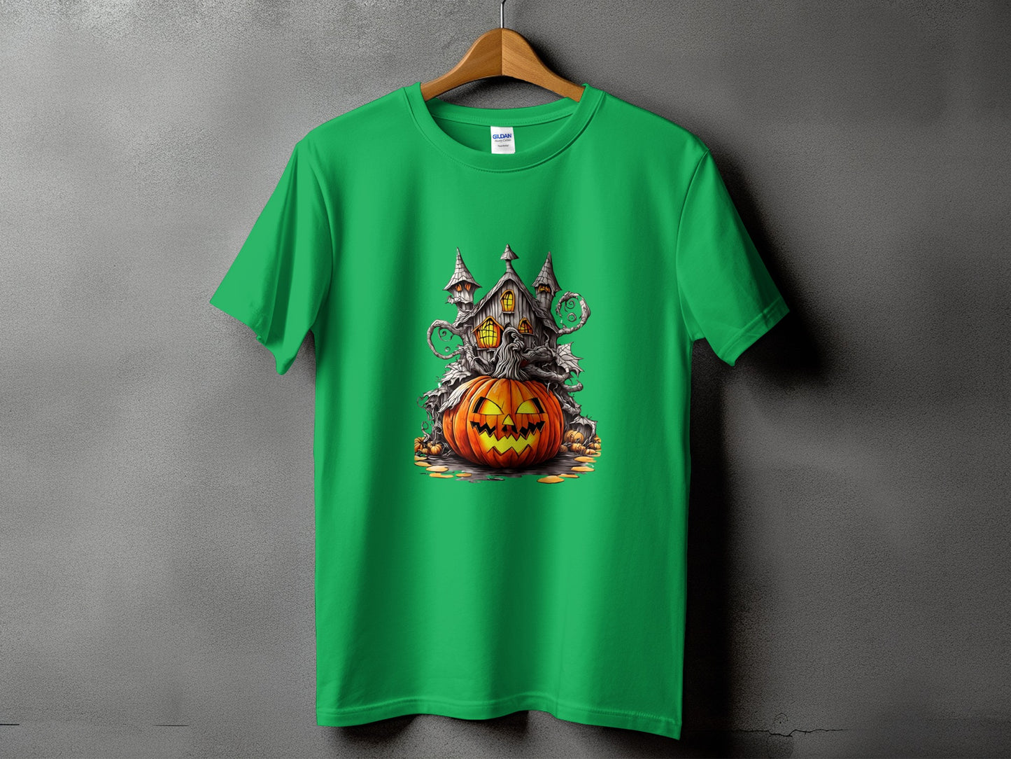 Green t-shirt with a Halloween-themed graphic featuring a haunted house and a jack-o'-lantern.
